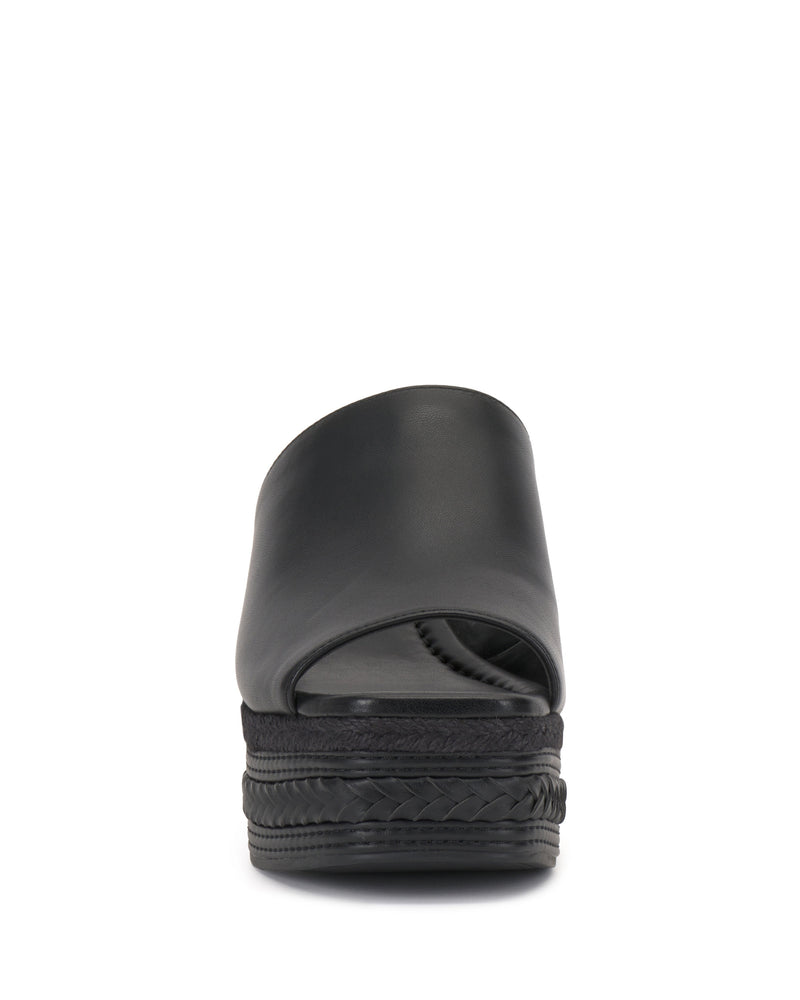 Front view of the Vince Camuto Lierna Espadrille Wedge Sandal in black, featuring a closed upper, open toe, and woven platform sole. The slip-on sandal is shown against a plain white background.