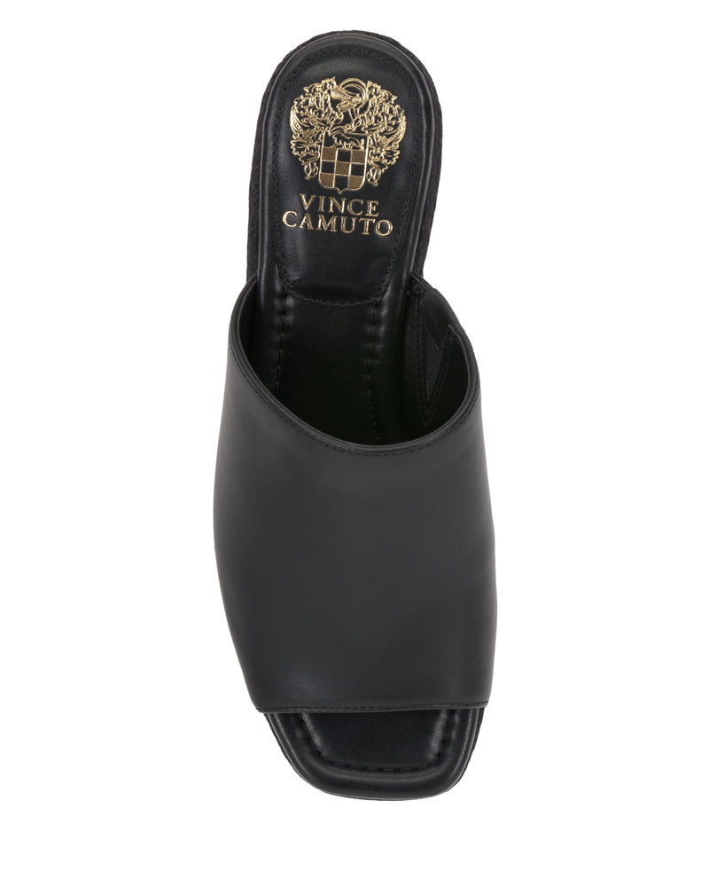 The Vince Camuto Lierna Espadrille Wedge Sandal is a stylish black open-toe design with a square toe and gold logo on the insole—ideal for pairing with Y2K-inspired or boho-chic outfits for a modern, trendy look.