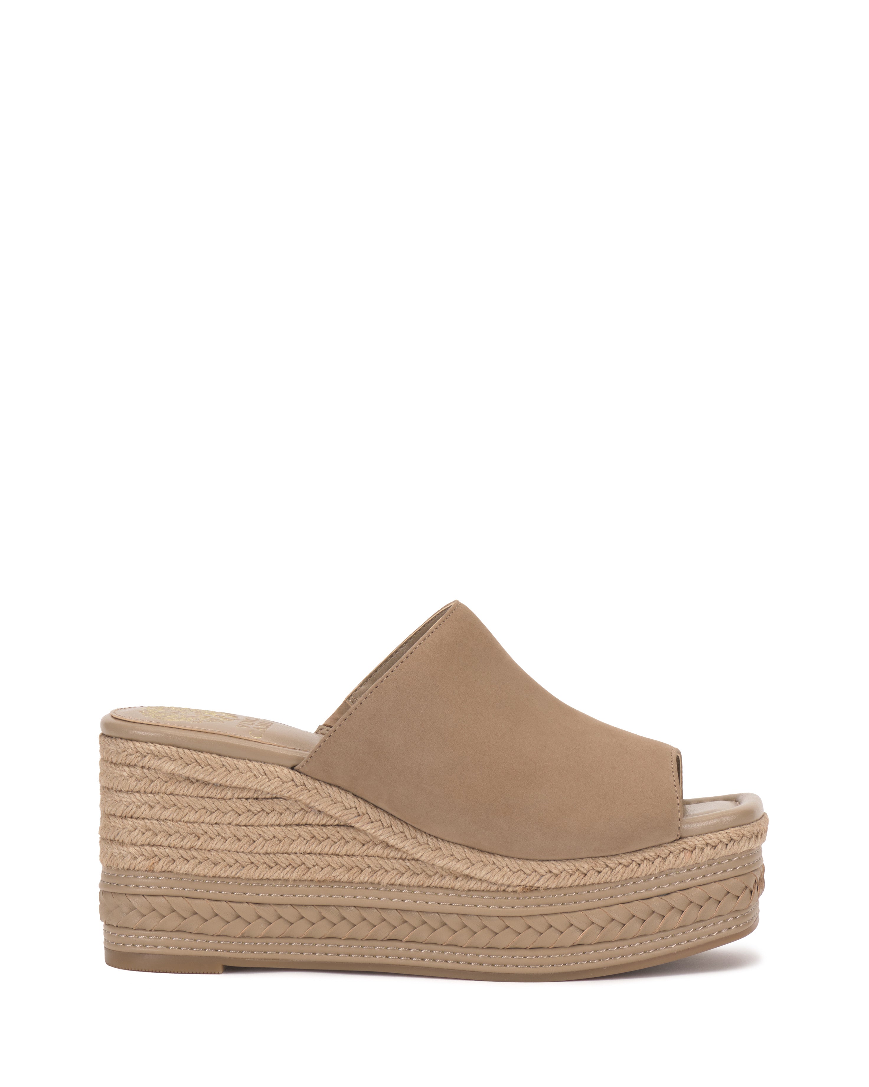 The Vince Camuto Lierna Espadrille Wedge Sandal showcases a tan, closed-toe slip-on design with an open back and rope-wrapped platform sole, blending stylish looks with easy wear.