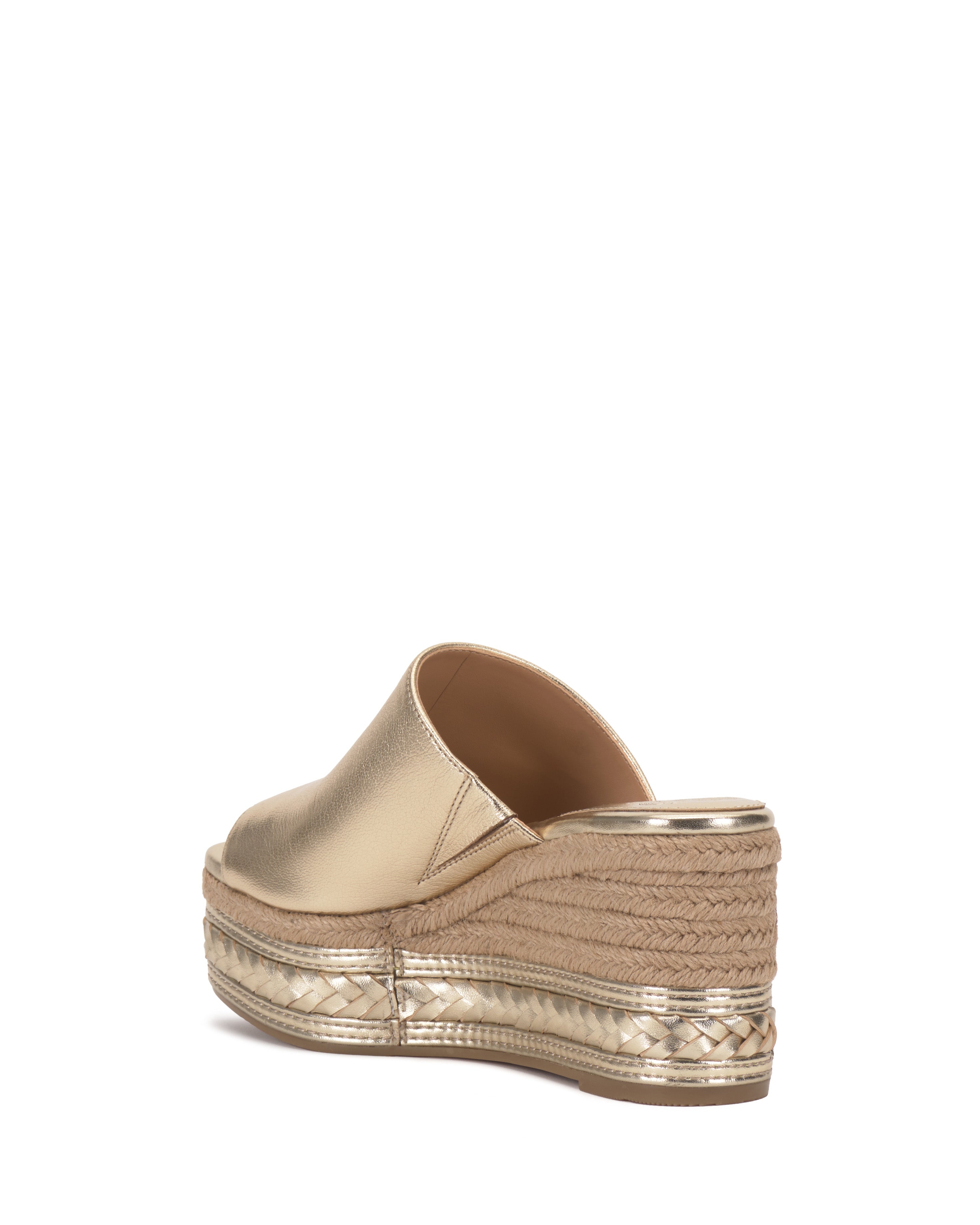 The Vince Camuto Lierna Espadrille Wedge Sandal features a gold metallic finish, closed toe, jute platform midsole, and textured gold sole, shown from the back against a white background.