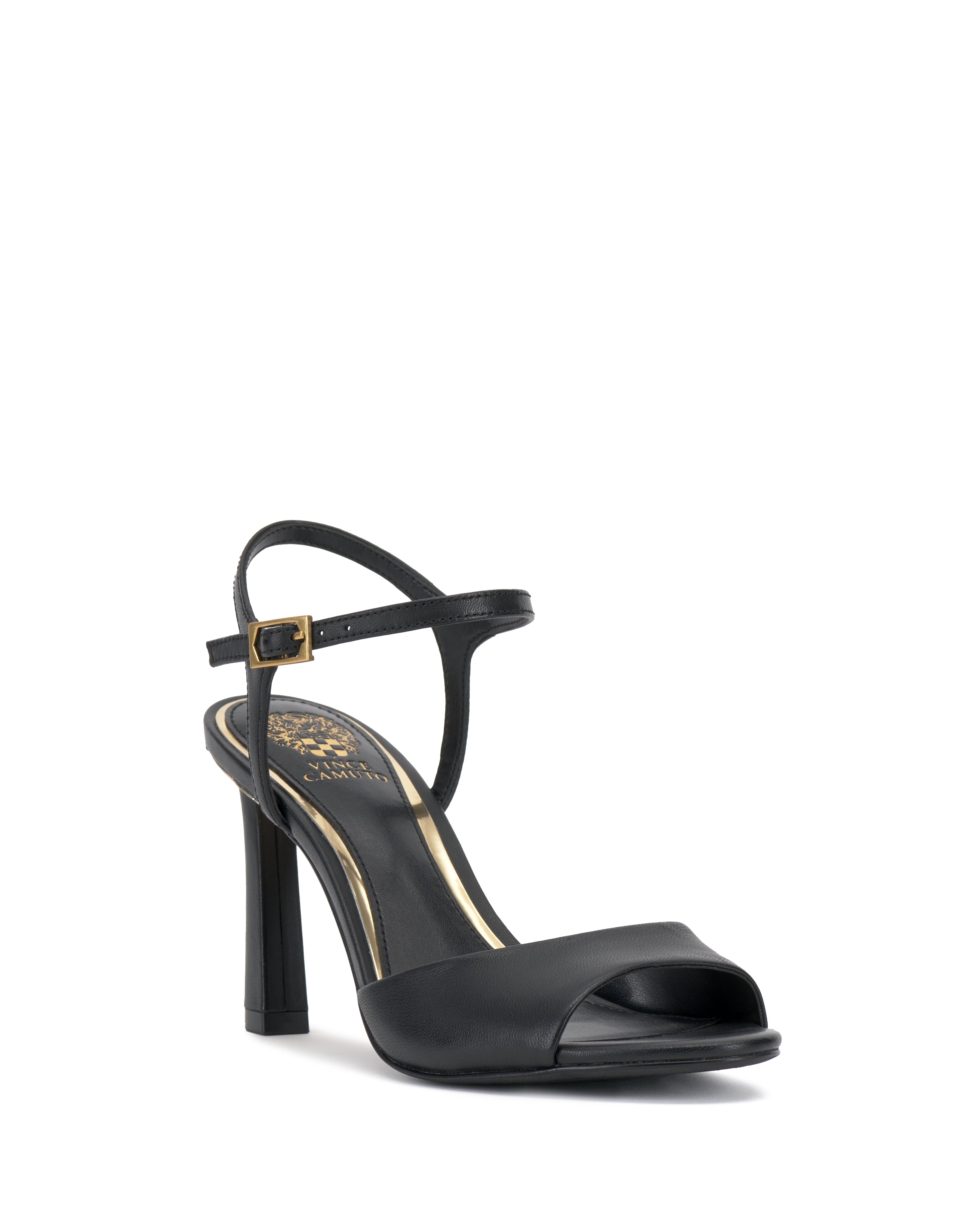 The Lilah Sandal by Vince Camuto is a classic black style with a tall slender heel, open toe, single front strap, and thin ankle strap with a gold accent buckle. A gold logo on the insole adds an elegant finishing touch.