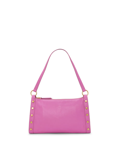 The Vince Camuto Lisha Shoulder Bag is a small pink leather handbag with gold hardware and studs, a single shoulder strap, a modern rectangular shape, and a top zipper closure.