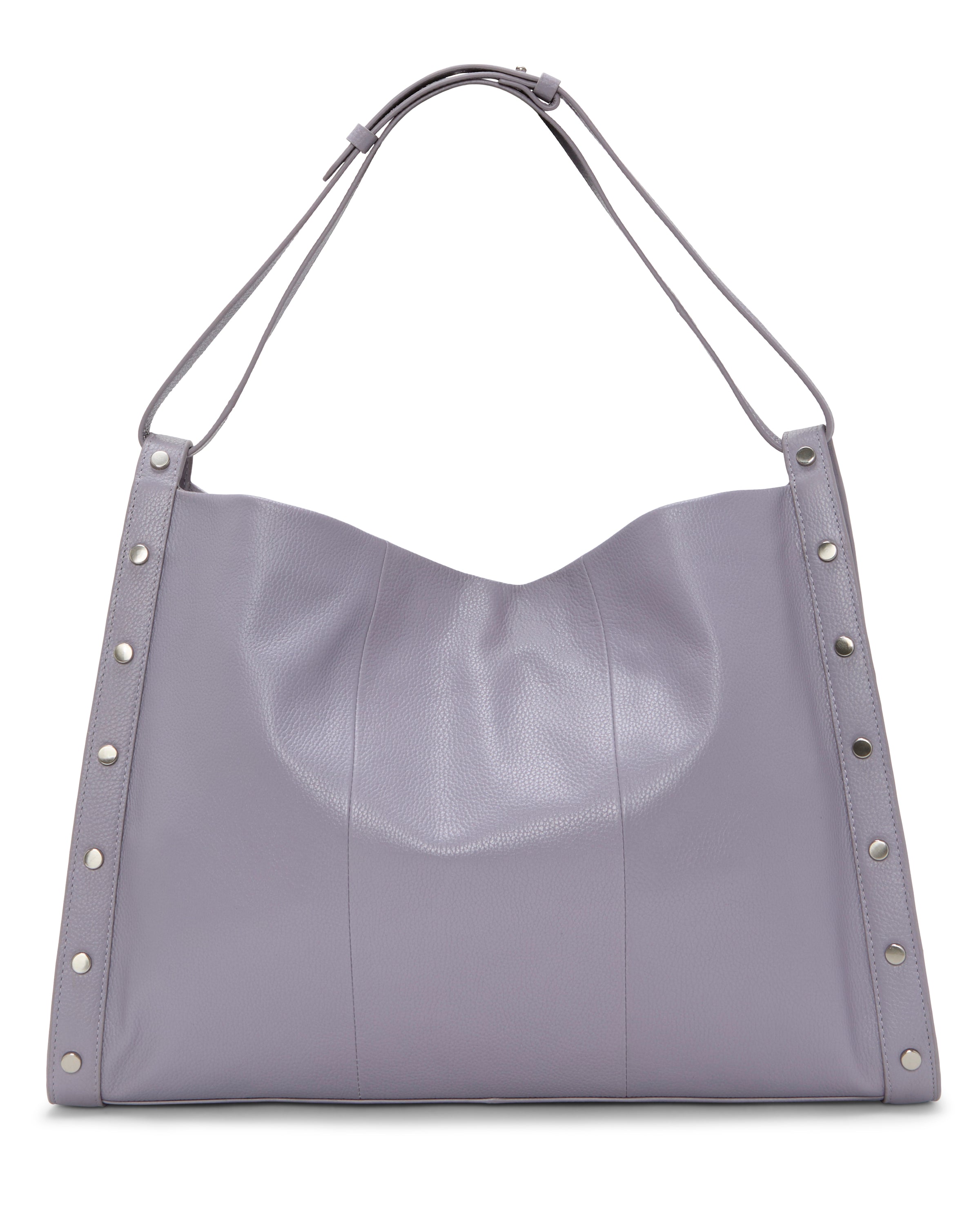The Vince Camuto Lisha Tote Bag is a spacious, soft lavender tote with silver studs on the sides and an adjustable shoulder strap, offering modern style and everyday versatility.