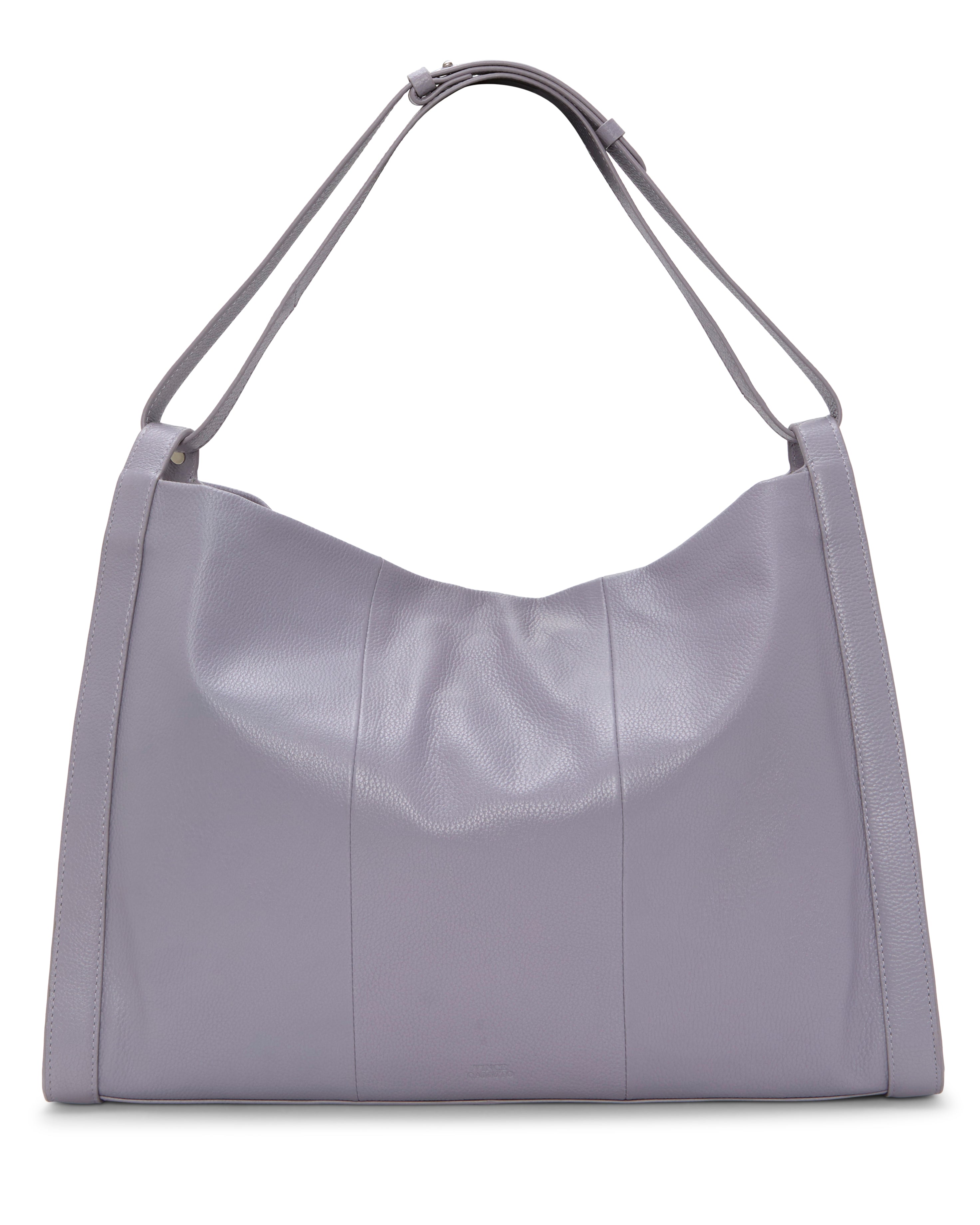 The Vince Camuto Lisha Tote Bag is a large lavender tote with a soft structure, two matching shoulder straps, minimal stitching, and a smooth, slightly textured finish—ideal for modern style and practical spaciousness.