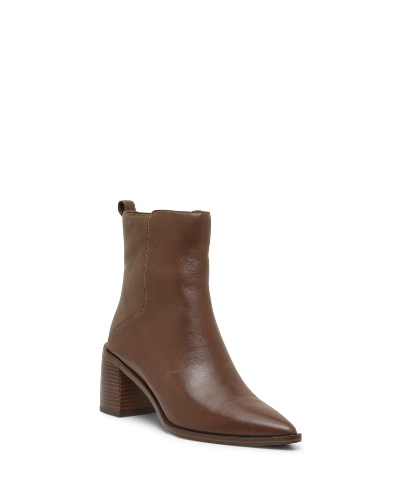 The Lorelai Bootie by Vince Camuto is a brown leather ankle boot with a modern design, showcasing a pointed toe, block heel, and convenient back pull tab, displayed against a plain white background.