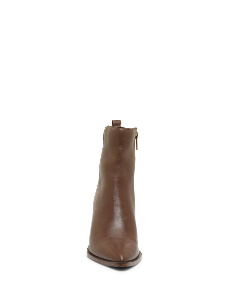 Front view of the Lorelai Bootie by Vince Camuto—a single brown leather pointed toe boot featuring a visible side zipper, modern style accents, and a back pull tab—displayed on a white background. This block heel design merges classic elegance with contemporary flair.