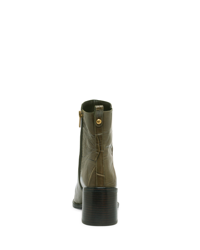Here’s a rewritten version using the provided product data: A single Vince Camuto Lorelai Bootie in olive-green leather, viewed from the back against a white background. This ankle boot showcases modern styling with visible stitching, a pointed toe, a side zipper, and a mid-height stacked block heel for an effortlessly chic look.