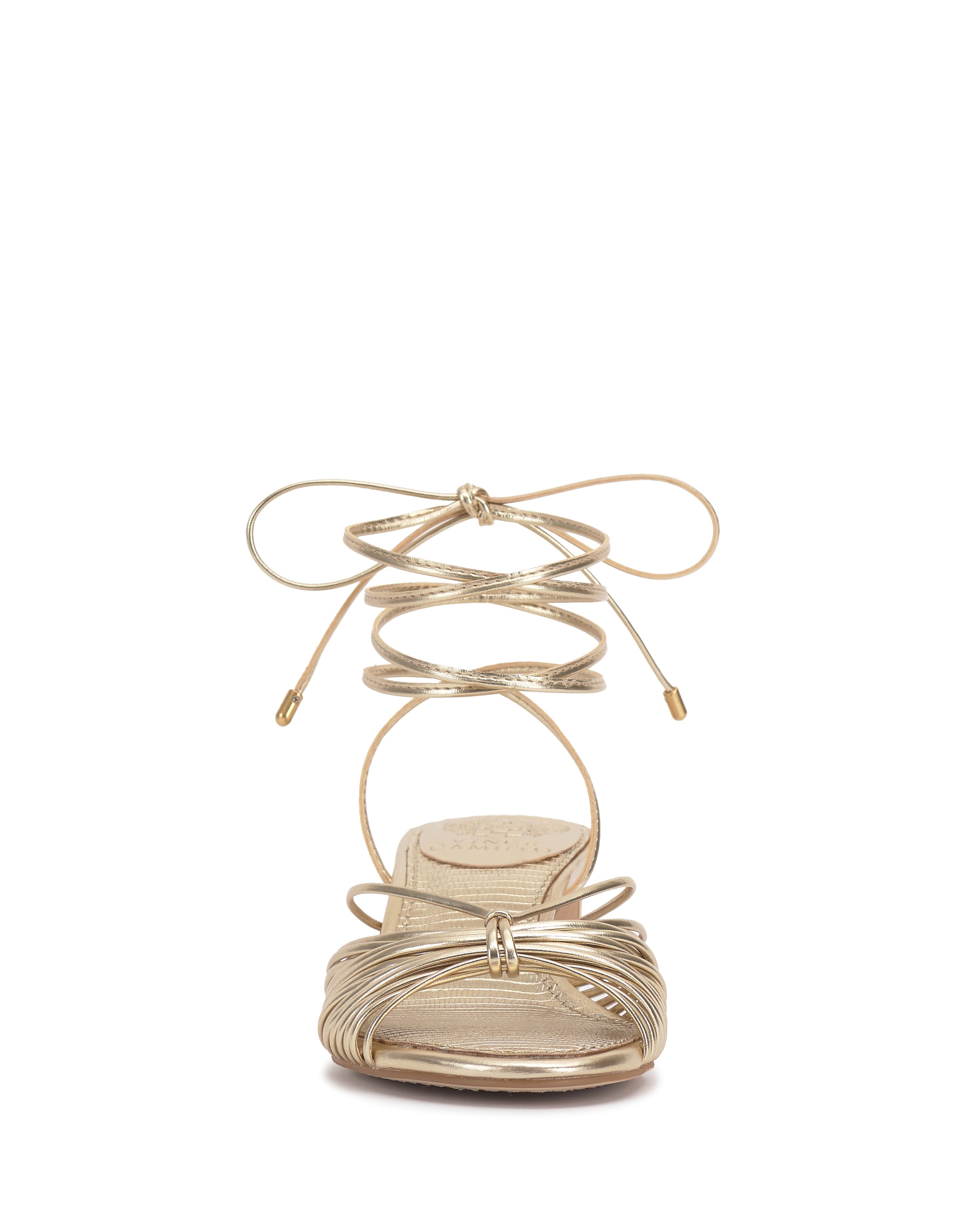 Front view of the Vince Camuto Lory Kitten Heel Sandal in gold, showcasing thin crisscross ankle tie laces, metallic accents, an open toe design, and a flattering low heel.