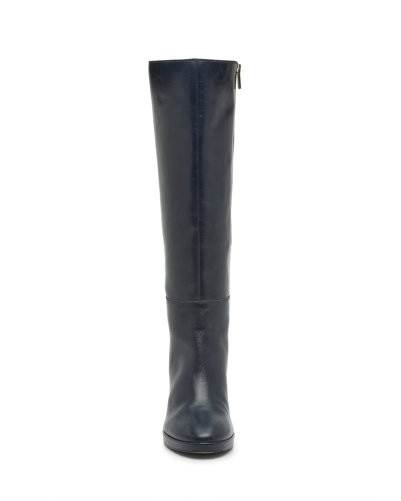 The Vince Camuto Lucina Knee High Boot is a tall black leather boot featuring a rounded toe, low block heel, and side zipper, displayed facing forward against a white background—an elegant and timeless choice for dress boots.