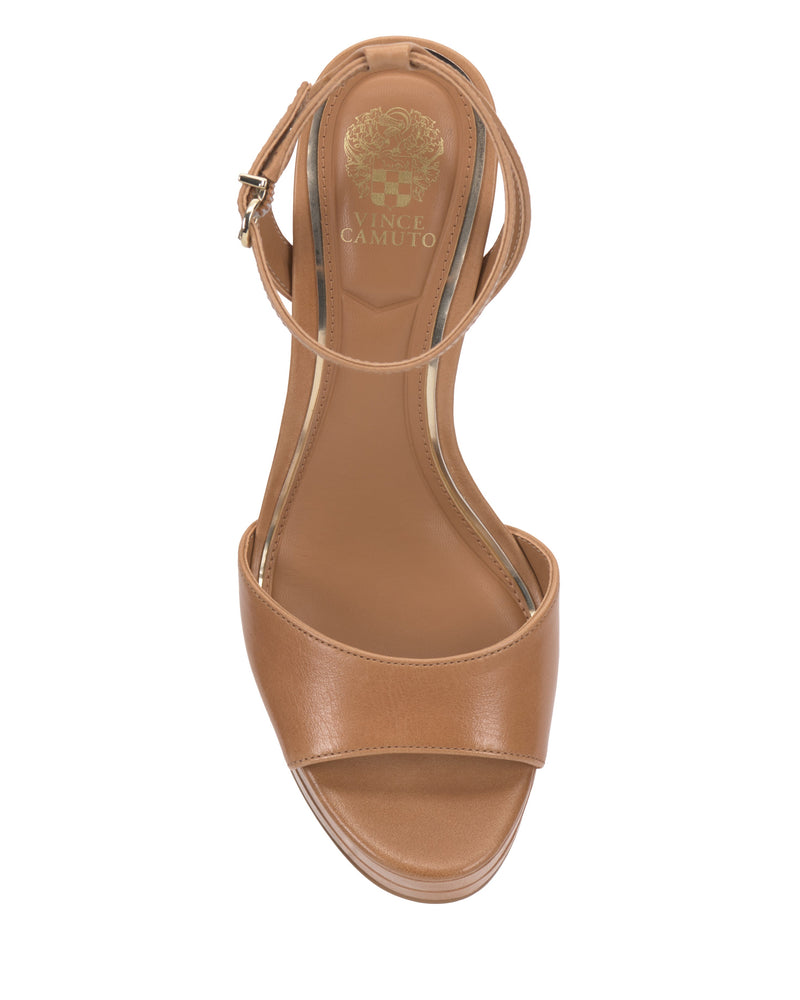 Top view of the Vince Camuto Lumary Platform Sandal in tan, featuring an open toe, adjustable ankle strap with buckle, and gold Vince Camuto logo printed on the insole. Photographed against a white background.