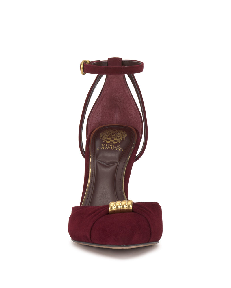 Front view of the Vince Camuto Mallie Pump, a burgundy suede high heel with an ankle strap, gold buckle accents, and a decorative knot on the toe, shown against a plain white background.