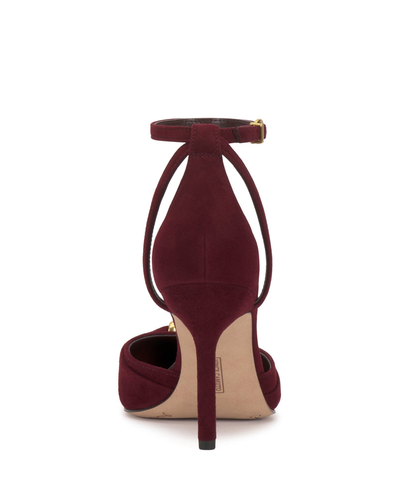 The Vince Camuto Mallie Pump in burgundy suede is shown from the back, showcasing its pointed toe, closed heel, and ankle strap with a gold buckle.