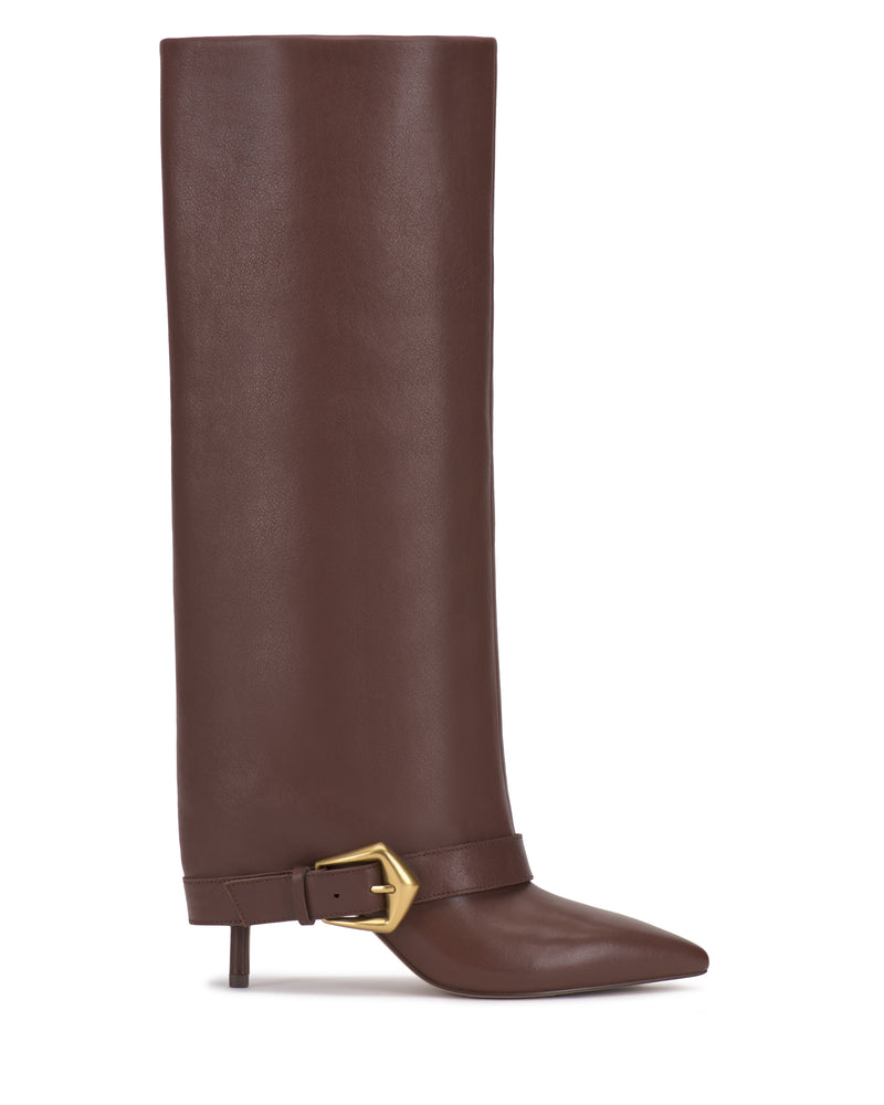 The Margee Wide Calf Cuff Knee High Boot by Vince Camuto features a tall, brown leather design with a pointed toe, short heel, and a gold buckle accent near the ankle. This boot showcases a sleek, smooth finish with no visible laces or zippers.