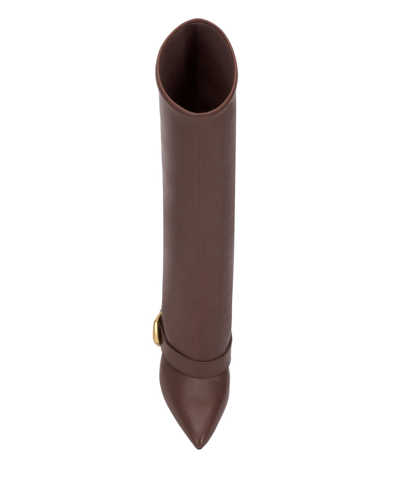 A top view of the Vince Camuto Margee Wide Calf Cuff Knee High Boot, featuring tall brown leather, a pointed toe, and a decorative strap with a gold buckle near the ankle, displayed on a white background.