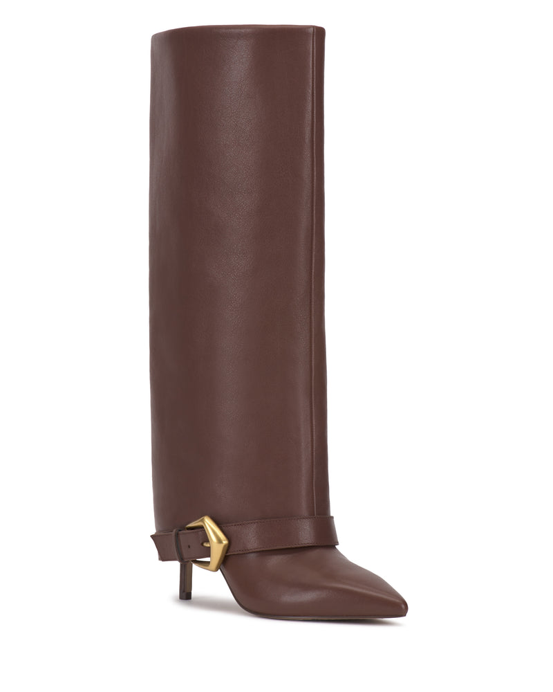 The Margee Cuff Knee High Boot by Vince Camuto is a tall brown leather boot featuring a pointed toe, low heel, and gold buckle detail around the ankle.