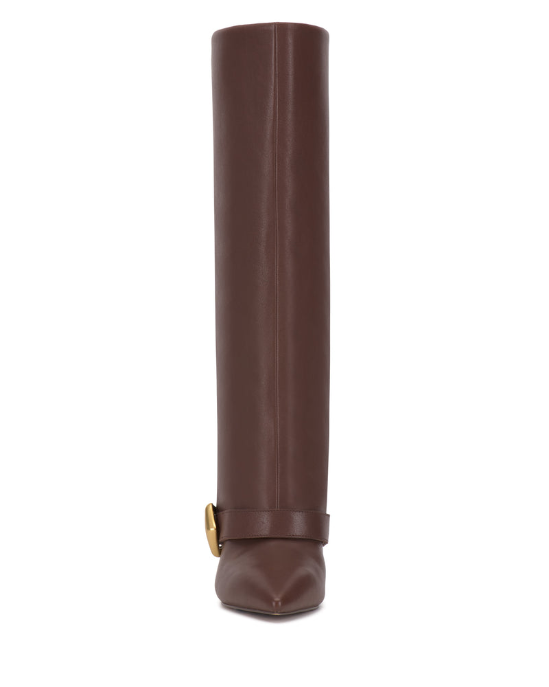 The Margee Cuff Knee High Boot by Vince Camuto is a tall brown leather boot shown from the front, featuring a pointed toe and an ankle strap adorned with a gold buckle detail.