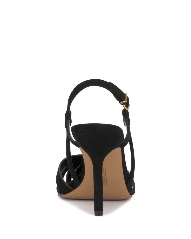 Back view of the Vince Camuto Marsia Pump, a black high-heeled sandal with a towering heel and ankle strap with gold buckle, highlighting the heel and sole against a white background.