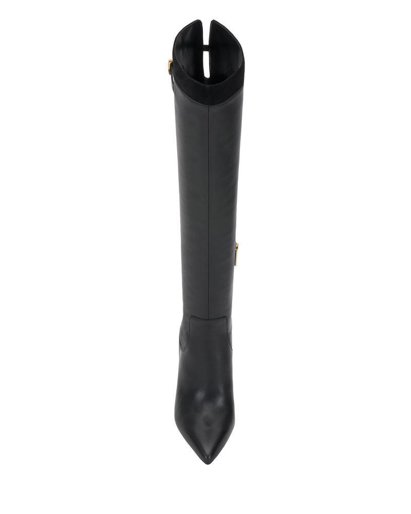 The Meleis Wide Calf Over the Knee Boot by Vince Camuto is a black, knee-high leather boot with a pointed toe, seen from above. It features a slight opening at the top and a subtle gold zipper on the side.