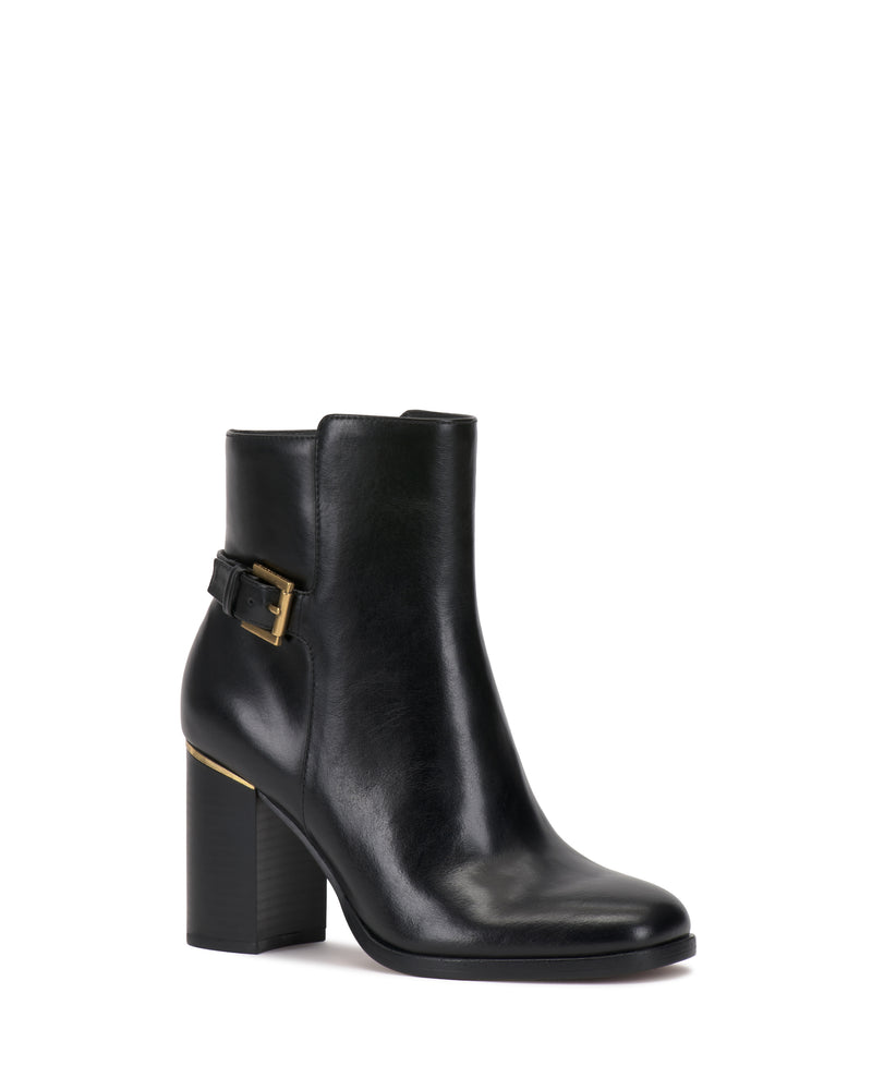 The Melvani Bootie by Vince Camuto features a high block heel, side buckle detail, and a smooth, shiny black leather finish, displayed against a white background.