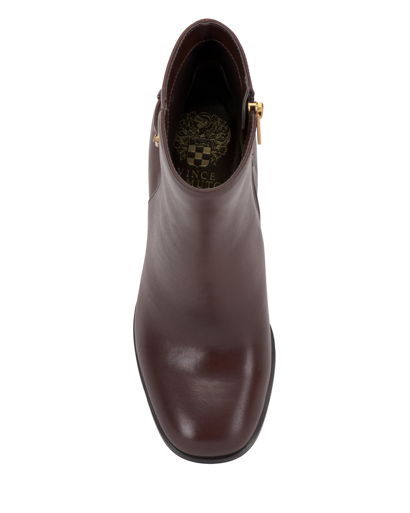 Top view of a single Melvani Bootie in brown leather with a gold zipper and Vince Camuto logo visible on the insole, photographed against a white background.