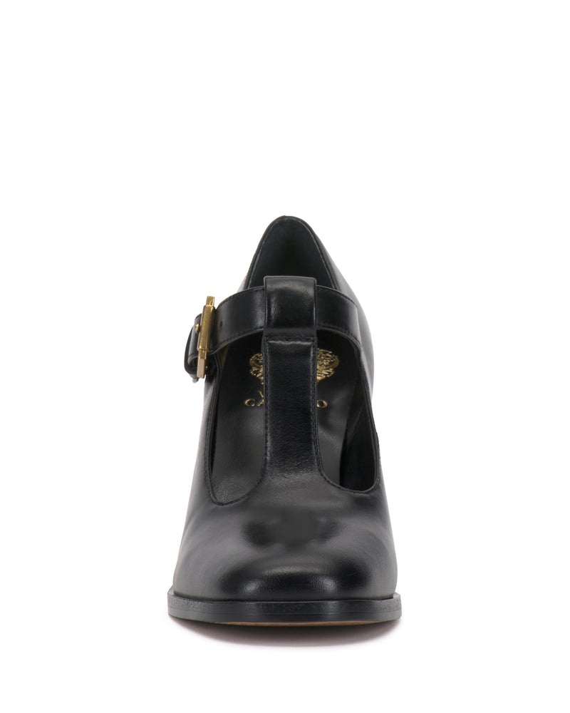 Black Vince Camuto Micha Pump with a T-strap, gold buckle, and vintage charm.