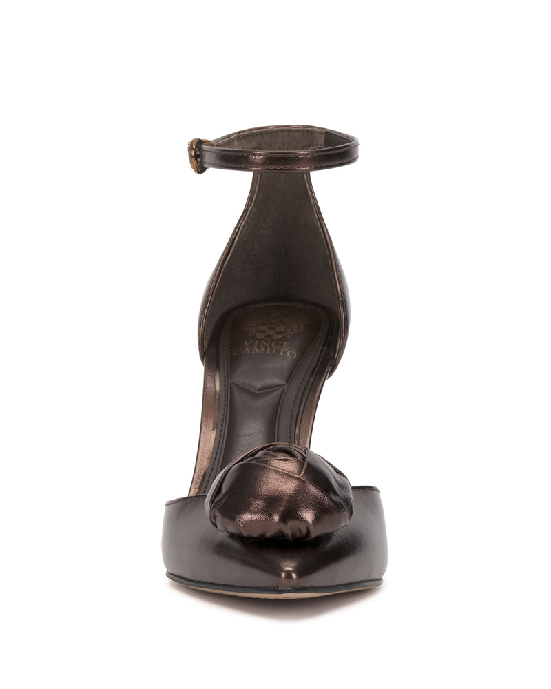 Front view of the Vince Camuto Mirezzo Pump featuring a shiny dark metallic finish, stiletto heel, closed toe, ankle strap, and an elegant knot detail on the toe.