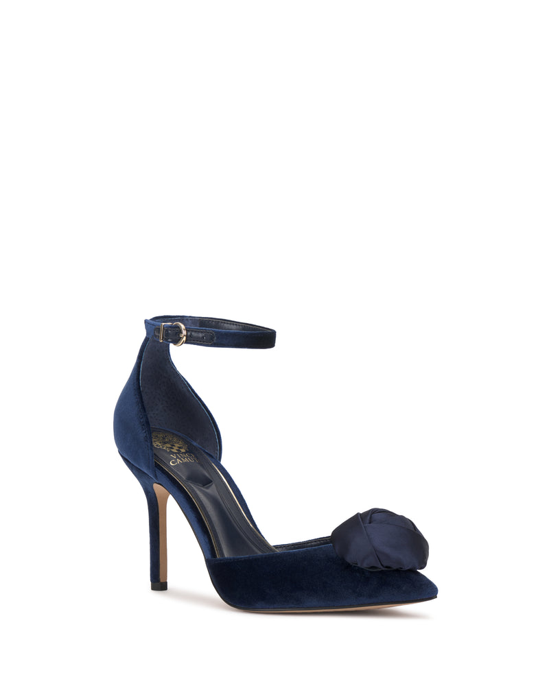 Navy blue velvet Mirezzo Pump by Vince Camuto with an ankle strap, stiletto heel, and large satin flower detail on the toe, shown on a white background.