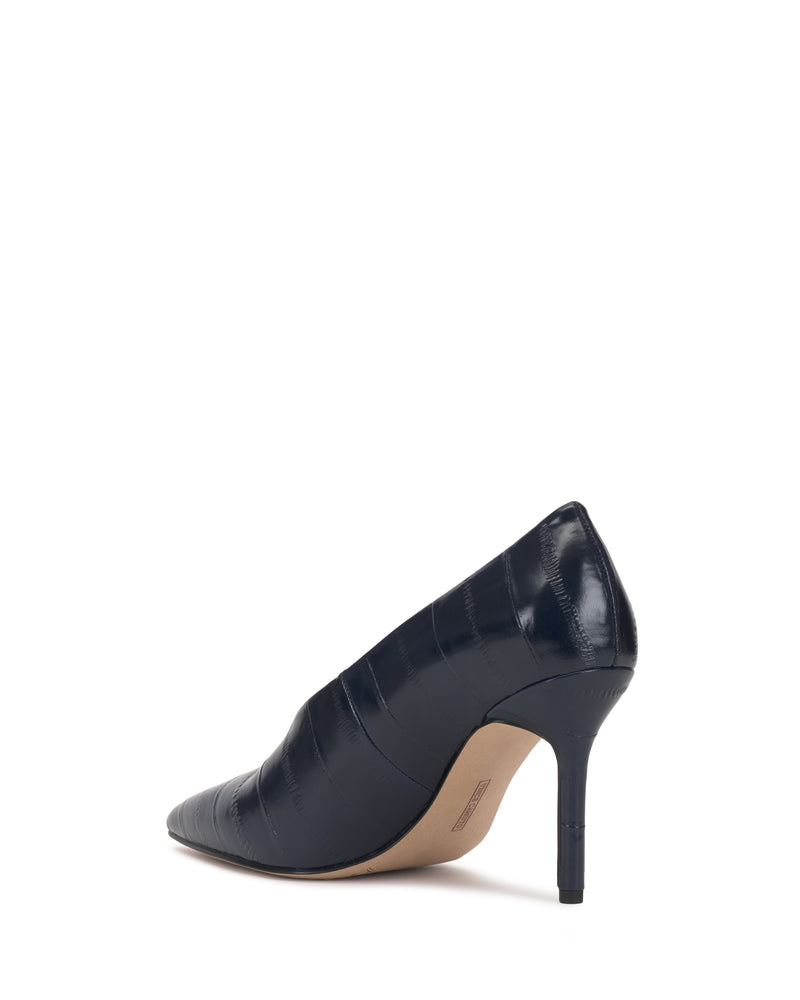 Sure! Here is the rewritten sentence using your product data: The Vince Camuto Mozlea Pump, a navy blue pointed-toe high heel with a textured, glossy finish, is shown from the back against a white background.