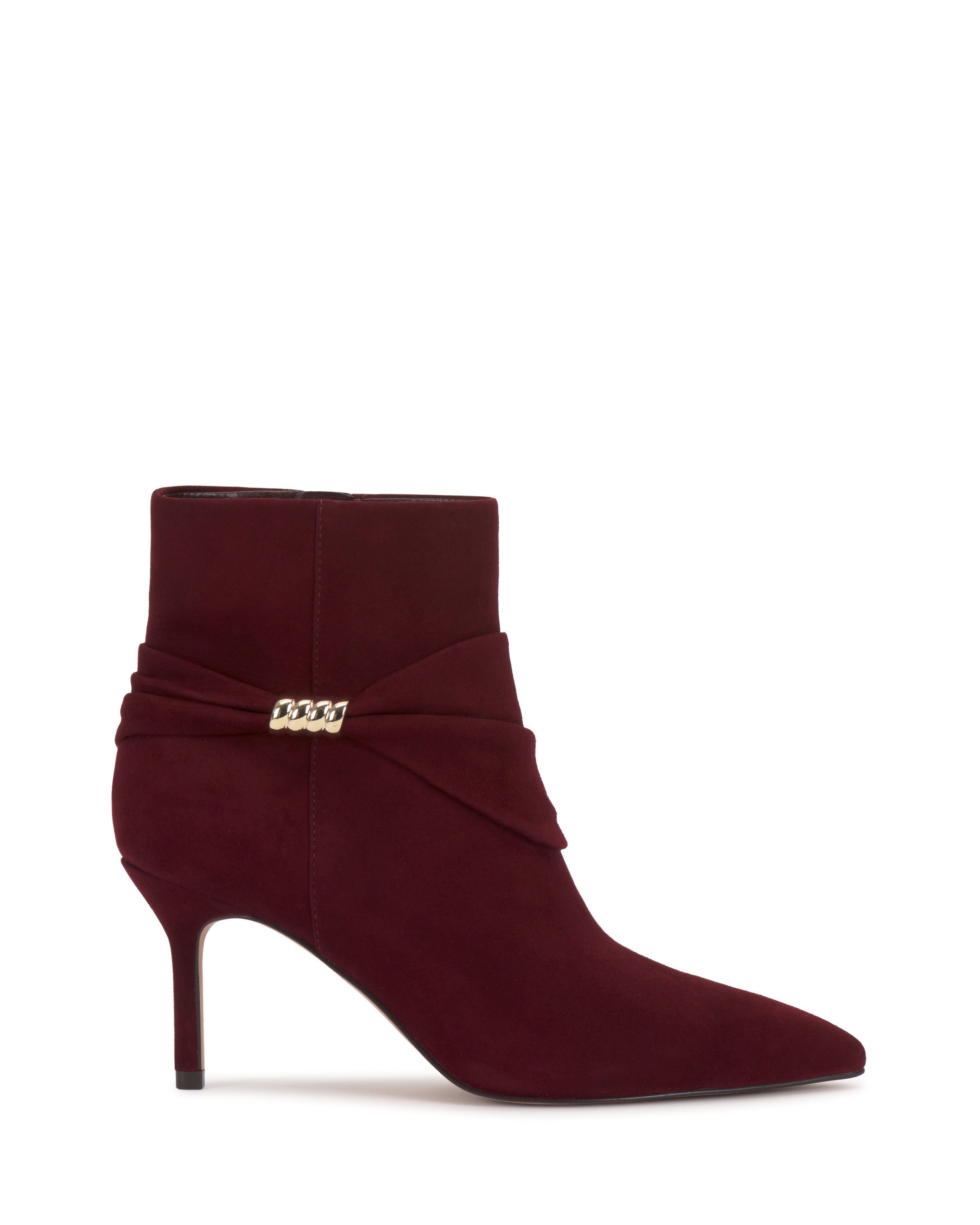 The Murlea Bootie by Vince Camuto features burgundy suede, a pointed toe, stiletto heel, and a gold chain detail on a wrapped strap at the ankle.