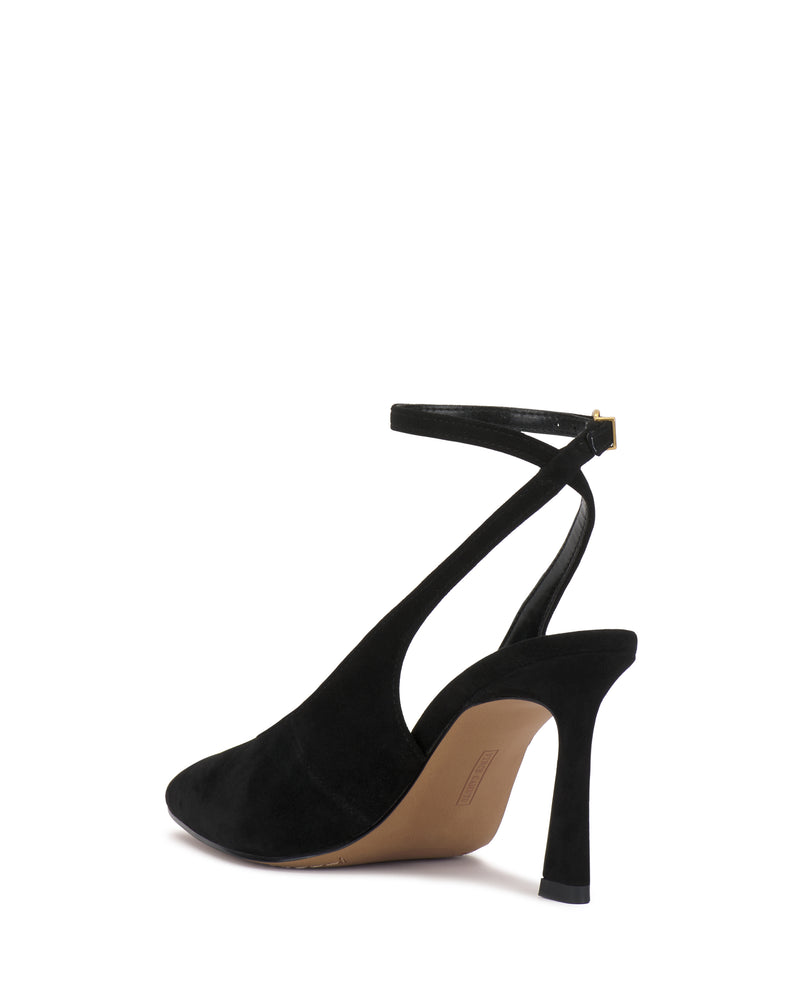 The Vince Camuto Nellah Pump is a black suede high-heeled shoe featuring a pointed toe and ankle strap, showcased at an angle against a white background.