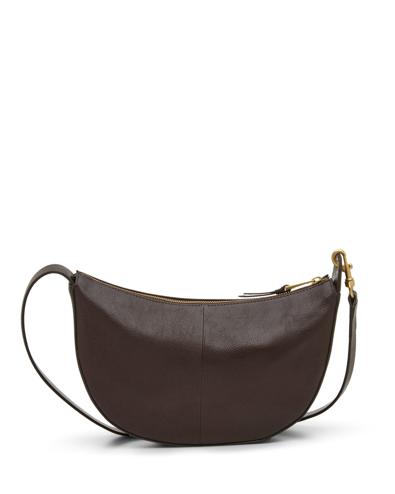 A dark brown Orlie Crossbody Bag by Vince Camuto is displayed on a white background. This crescent-shaped bag features a gold zipper with matching hardware and exemplifies modern style and high-quality craftsmanship for a timeless look.