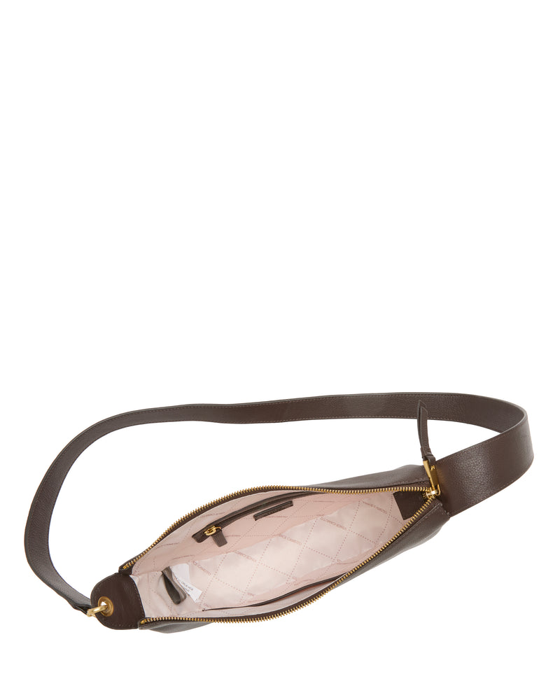 Top view of the Orlie Crossbody Bag by Vince Camuto, a contemporary accessory made from brown leather featuring a gold zipper, beige quilted fabric lining, an interior zip pocket, and an adjustable strap that showcases its premium craftsmanship.