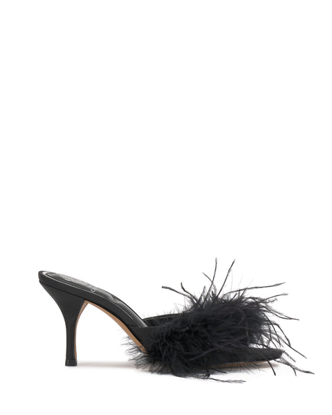The Paelly Feather Mule by Vince Camuto is a black, open-toe, high-heeled mule featuring a sleek design and a striking plume of black feathers across the front.