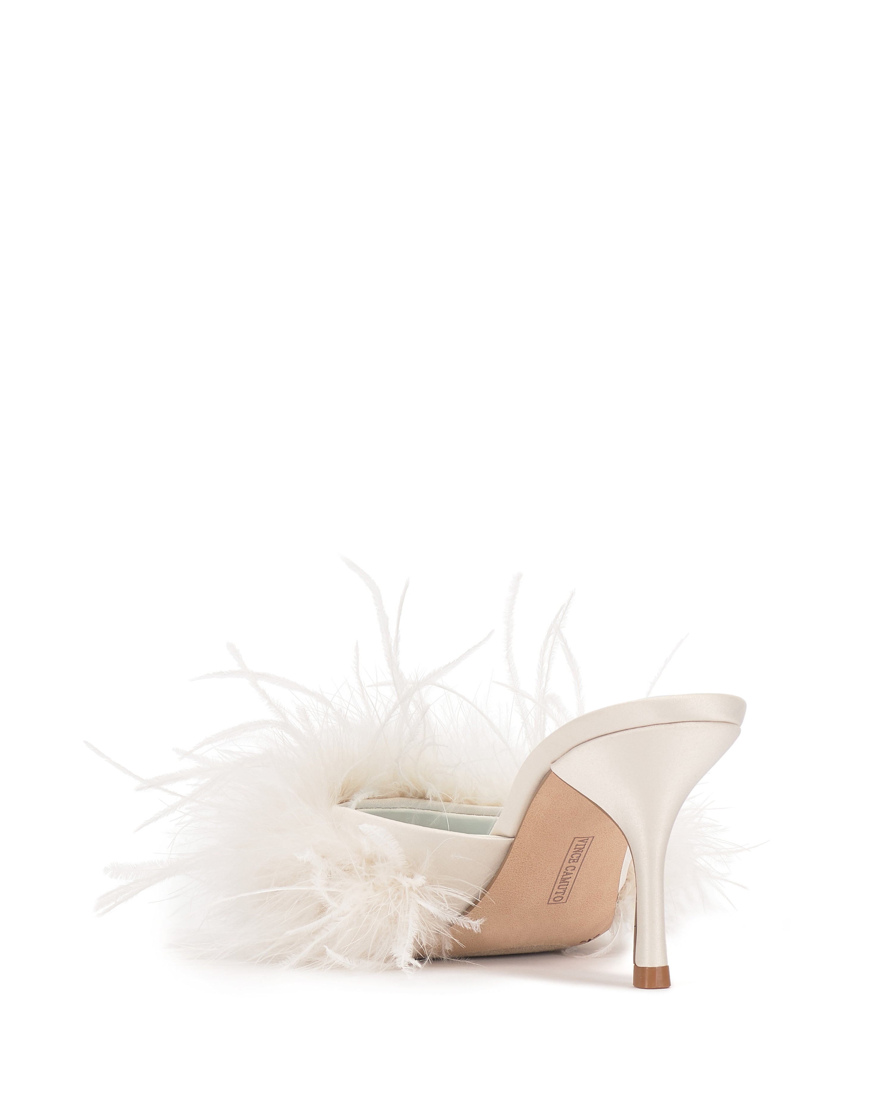The Paelly Feather Mule by Vince Camuto is a chic women’s evening heel with a satin finish, pointed toe, white fluffy front feathers, thin heel, and open back, shown on a plain white background.