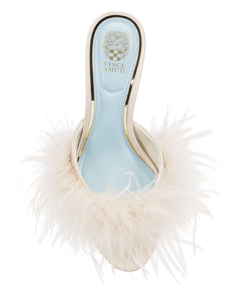 The Paelly Feather Mule by Vince Camuto is a cream slip-on high heel featuring a light blue insole and fluffy feather trim around the front.