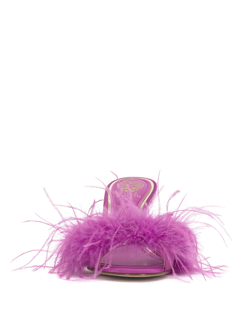 The Vince Camuto Paelly Feather Mule is a bright purple, open-toed sandal with high heels and fluffy feathery trim across the upper, shown from the front on a white background.