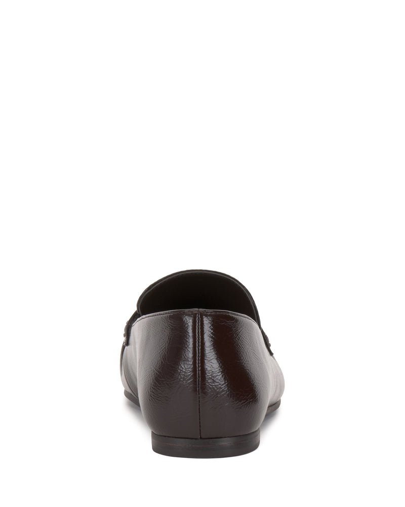 The Vince Camuto Paelyn Penny Loafer in dark brown leather is displayed from the back against a white background.