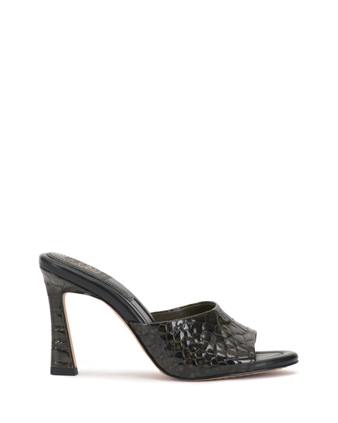 The Vince Camuto Paigely Mule is a single black, glossy, crocodile-embossed minimalist shoe with an open toe and flared heel, displayed in side profile on a white background.
