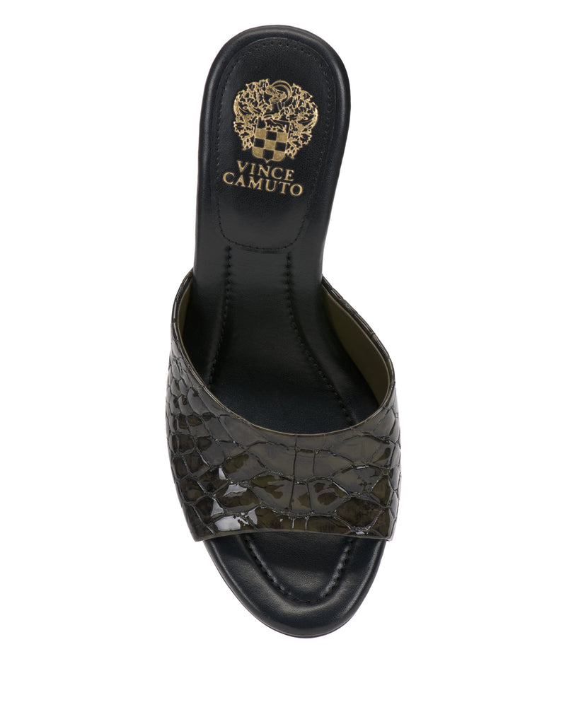 The Vince Camuto Paigely Mule is a black minimalist slide sandal with a wide, crocodile-textured strap, flared heel, and gold logo on the insole, shown from an overhead view.