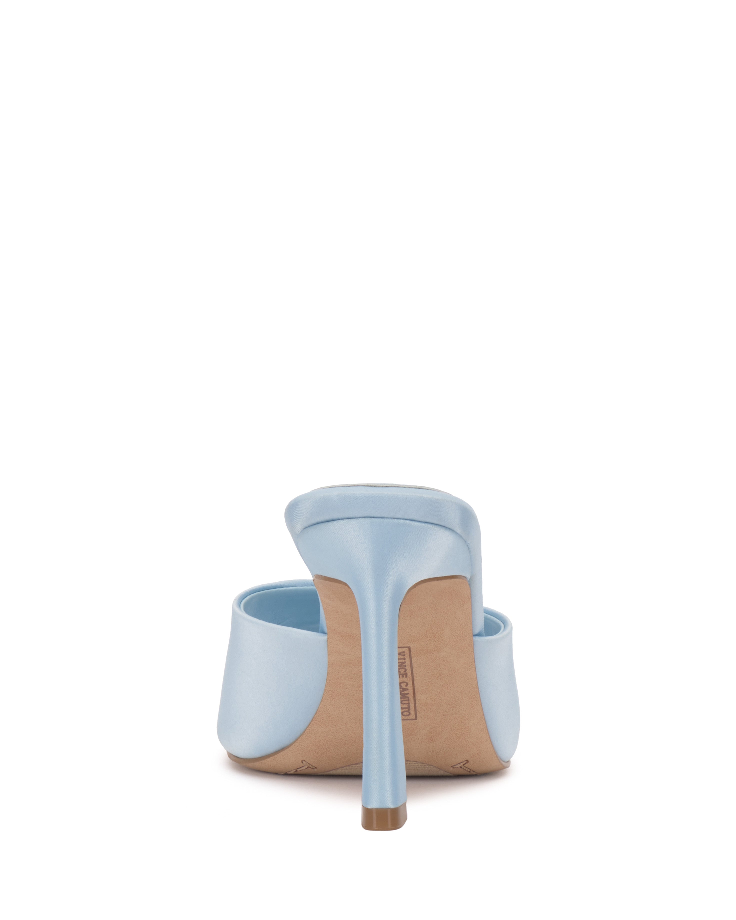 The Vince Camuto Paigely Mule is displayed in light blue from the back against a white background, showcasing its flared heel and sleek sole.