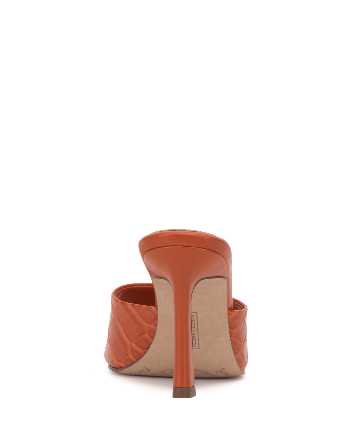 The Paigely Mule by Vince Camuto is an orange quilted minimalist mule shown from the back, highlighting its flared heel and a partial view of the padded upper.