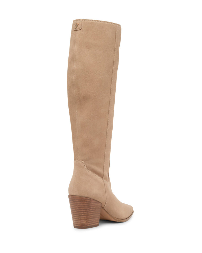The Pamlia Extra Wide Calf Knee High Boot by Vince Camuto features tan suede, a low stacked wooden block heel, and a slightly pointed toe, shown from a back-side angle.