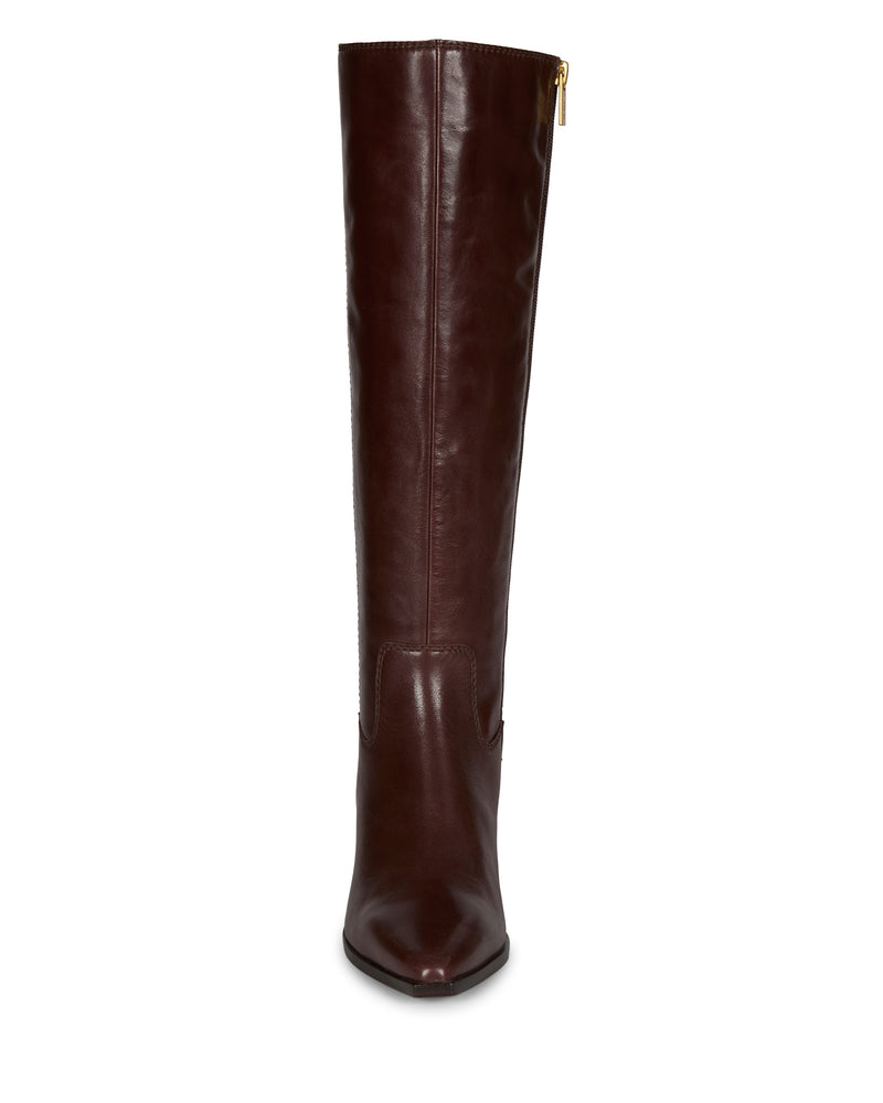 The Vince Camuto Pamlia Knee High Boot is a tall, dark brown leather boot with a rounded toe, gold zipper, slight block heel, and subtle western details. Shown from the front.