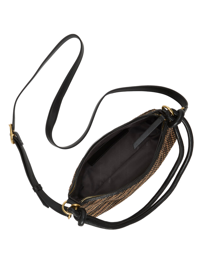 The Paula Crossbody Bag by Vince Camuto features a woven design, a black adjustable strap, gold hardware, and opens to a roomy black interior with a small pocket.