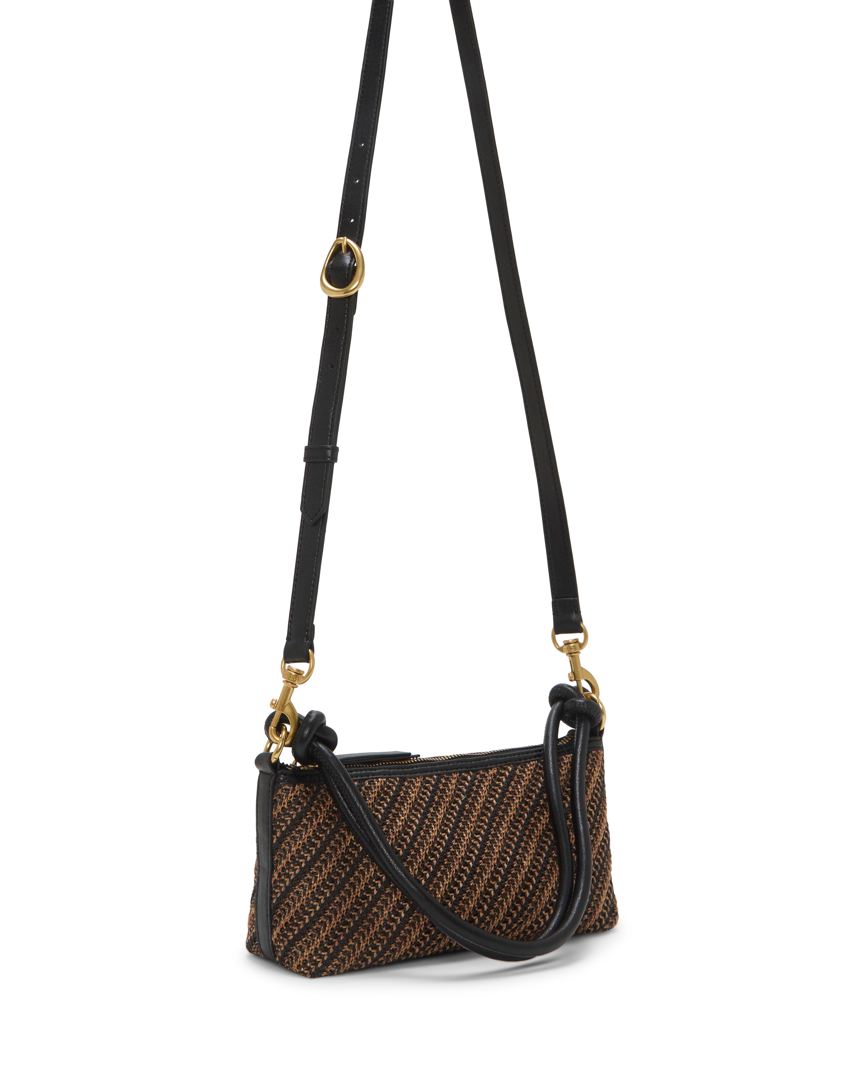 The Vince Camuto Paula Crossbody Bag is a small rectangular bag with a brown and black woven pattern, black adjustable strap, gold-tone hardware, and zippered top.