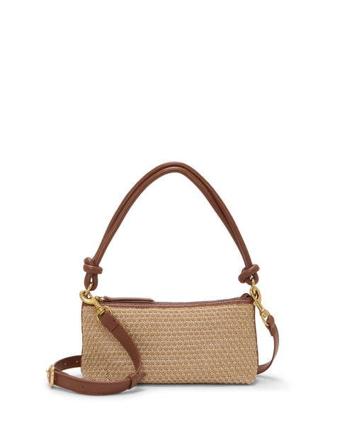 The Paula Crossbody Bag by Vince Camuto is a small rectangular woven beige handbag with brown leather trim, dual handles, gold hardware, and a detachable shoulder strap, shown against a white background.