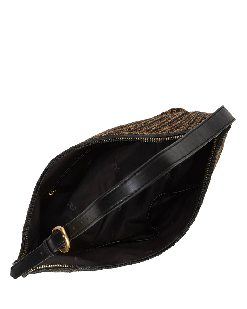 Top view of the Paula Shoulder Bag by Vince Camuto, featuring brown woven material, a black leather strap with gold hardware, and a black fabric-lined interior with multiple pockets.