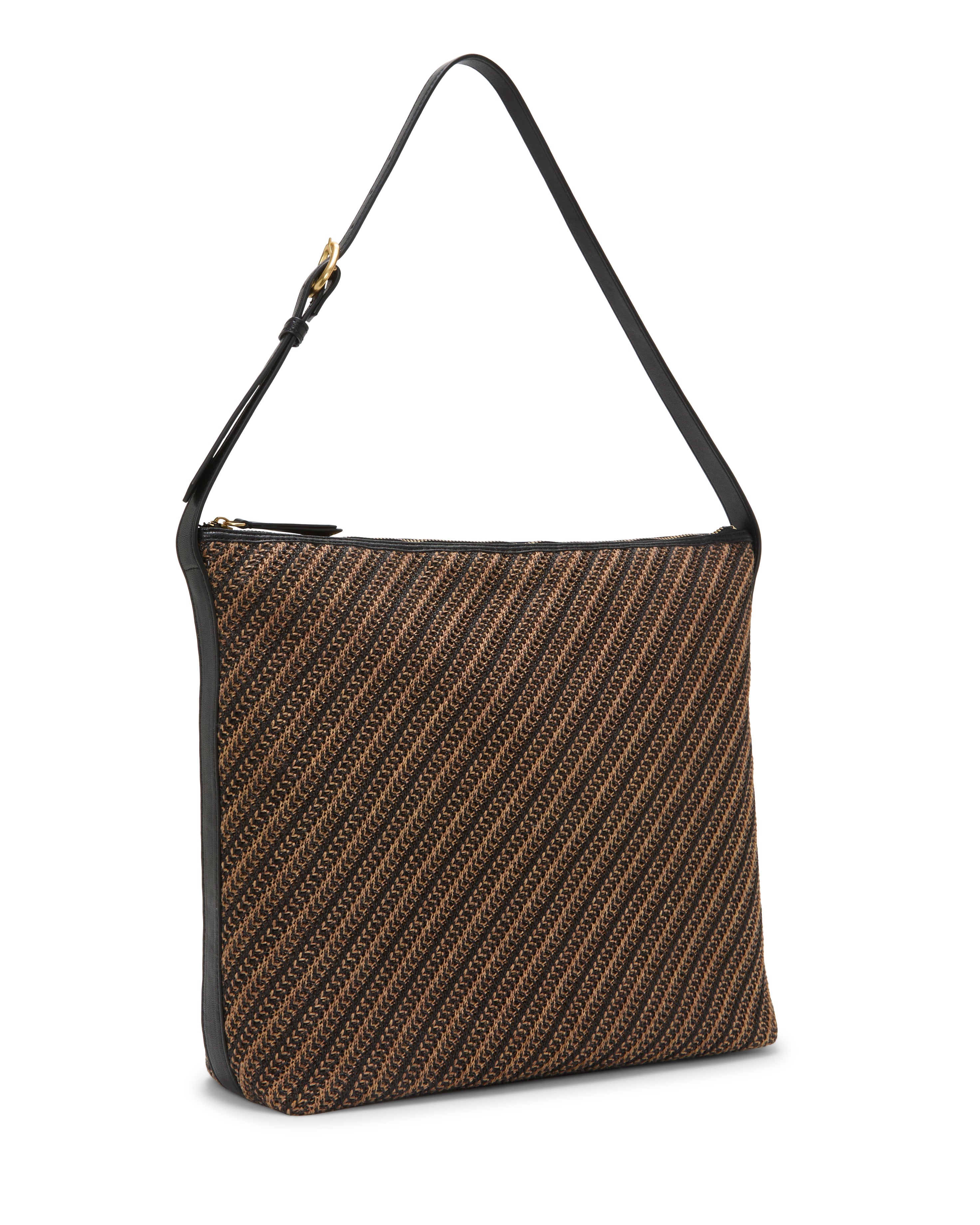 The Paula Shoulder Bag by Vince Camuto is a rectangular canvas bag with brown and black diagonal stripes, black trim, an adjustable strap, and a zippered top closure for security and style.