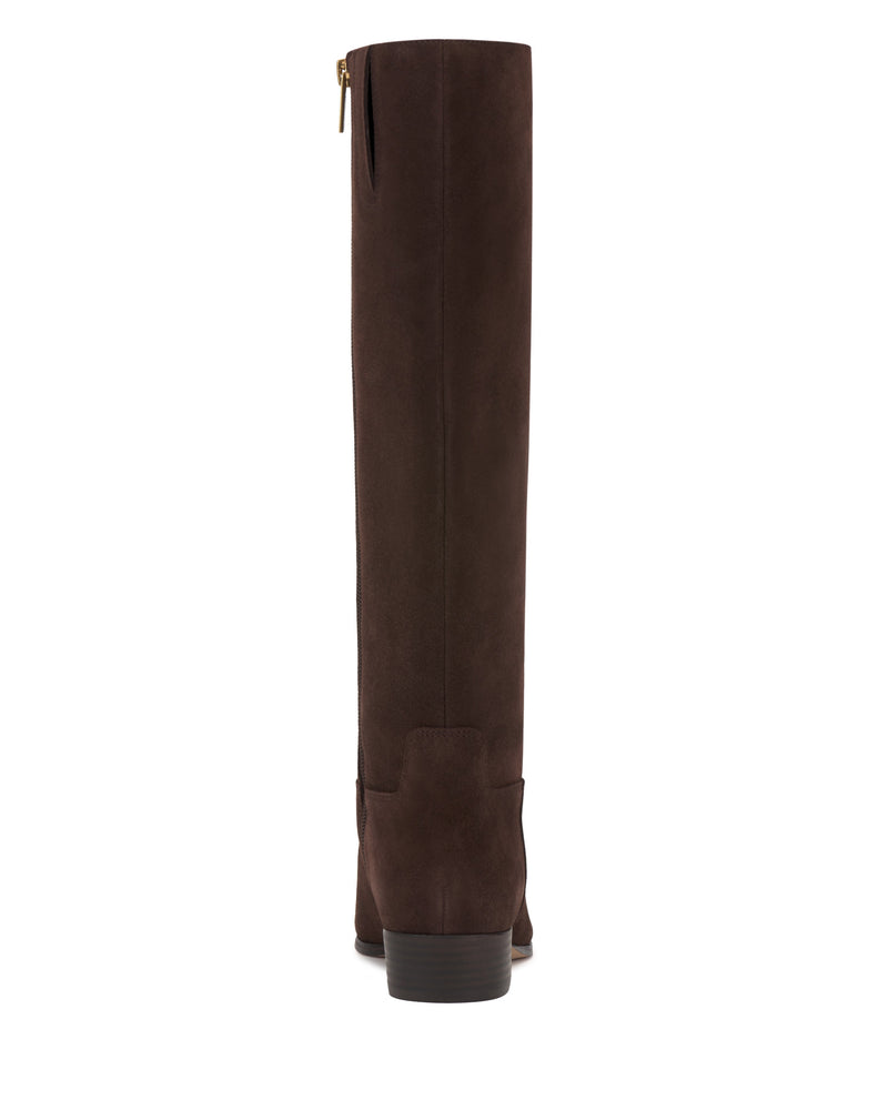 The Vince Camuto Pavla Narrow Calf Knee High Boot is a tall, dark brown suede boot with a low stacked heel and upper side zipper, shown from the back against a white background.