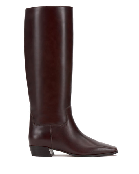 The Vince Camuto Pavla Narrow Calf Knee High Boot is a tall dark brown leather boot with western styling, a low square block heel, and an almond toe, shown in profile against a white background.